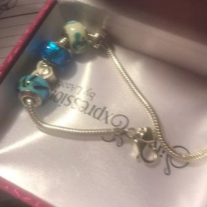 Started Pandora bracelet with 4 charms